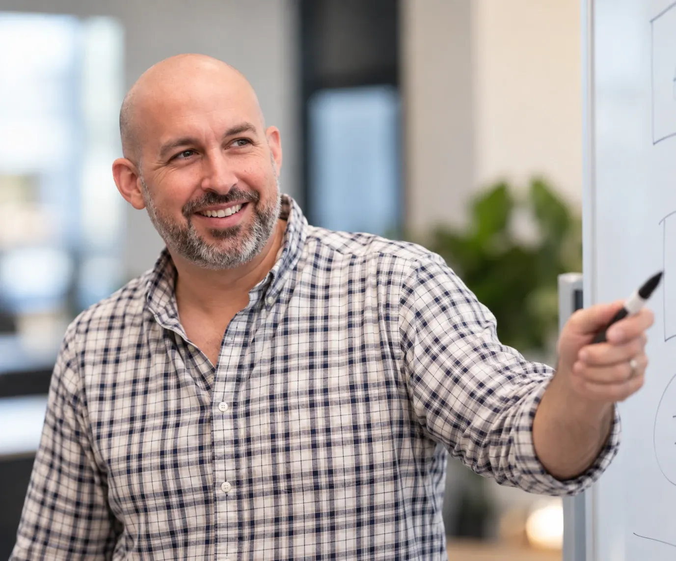 David Pesce explaining an idea at a whiteboard